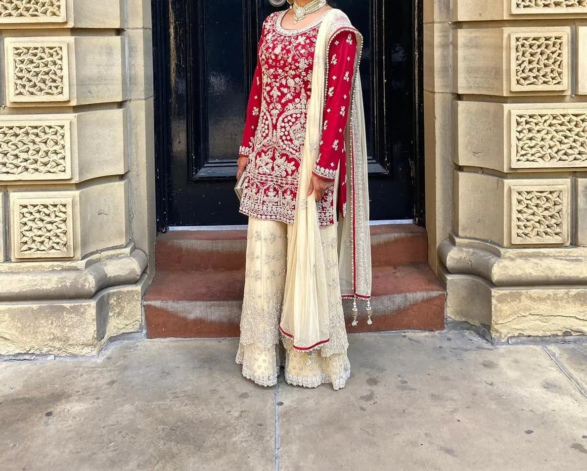 Women’s red and cream wedding dress