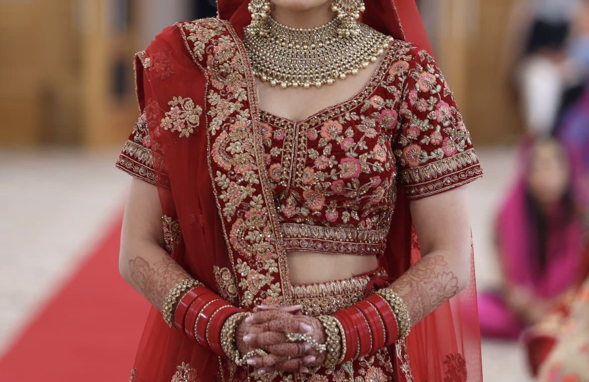 Monga’s red bridal lengha