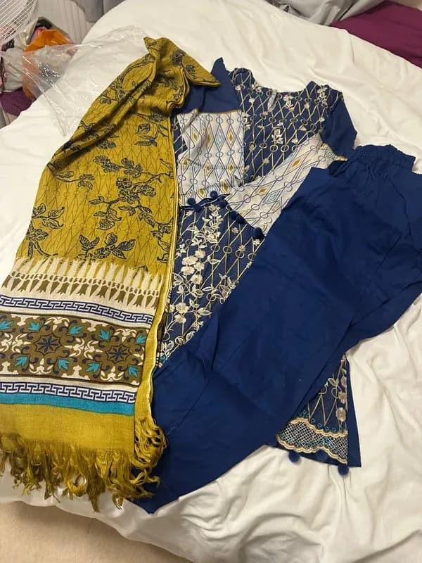 Lovely soft 3 piece suit with pom pops bottom of kameez and arms. — image 1