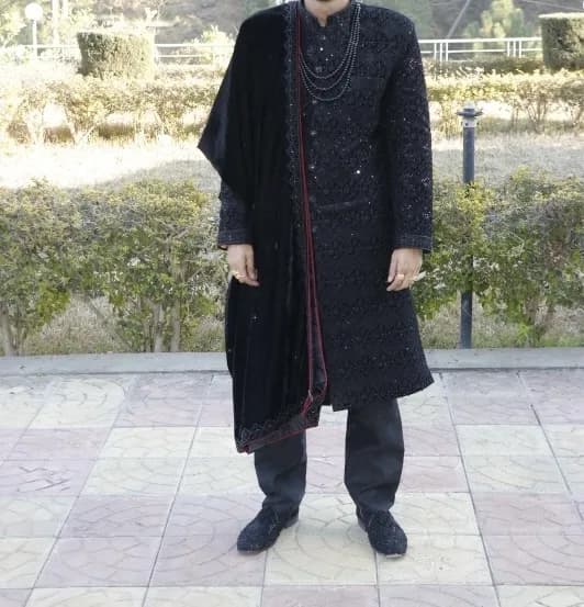 Men’s black sharwani with beautiful velvet scarf and necklace — image 1