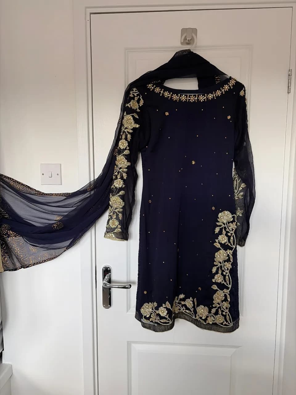Navy blue with gold embroidery. — image 1