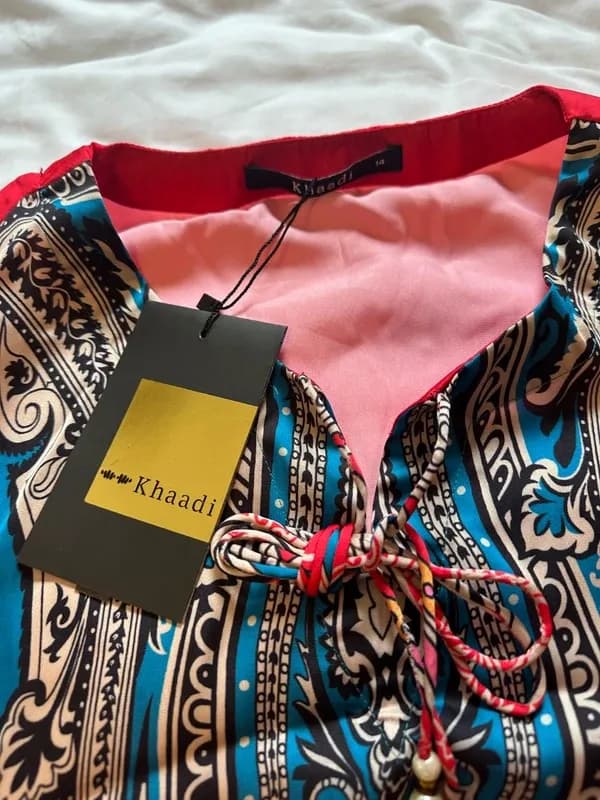 Khaddi front and back printed kurta with tassels at neck size 14 — image 1