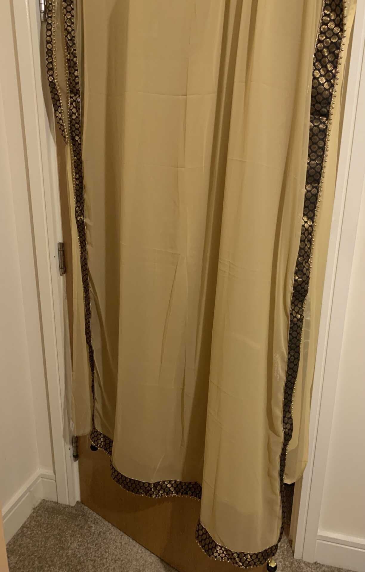 Gold and black Indian saree — image 1