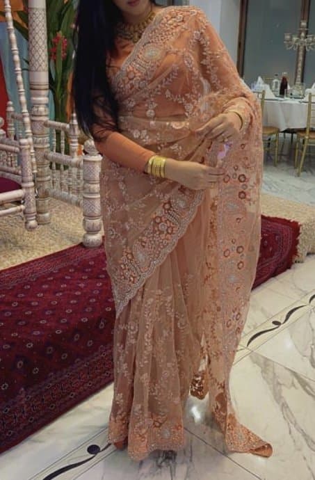 Coral saree with satin burnt orange blouse and petty coat — image 1