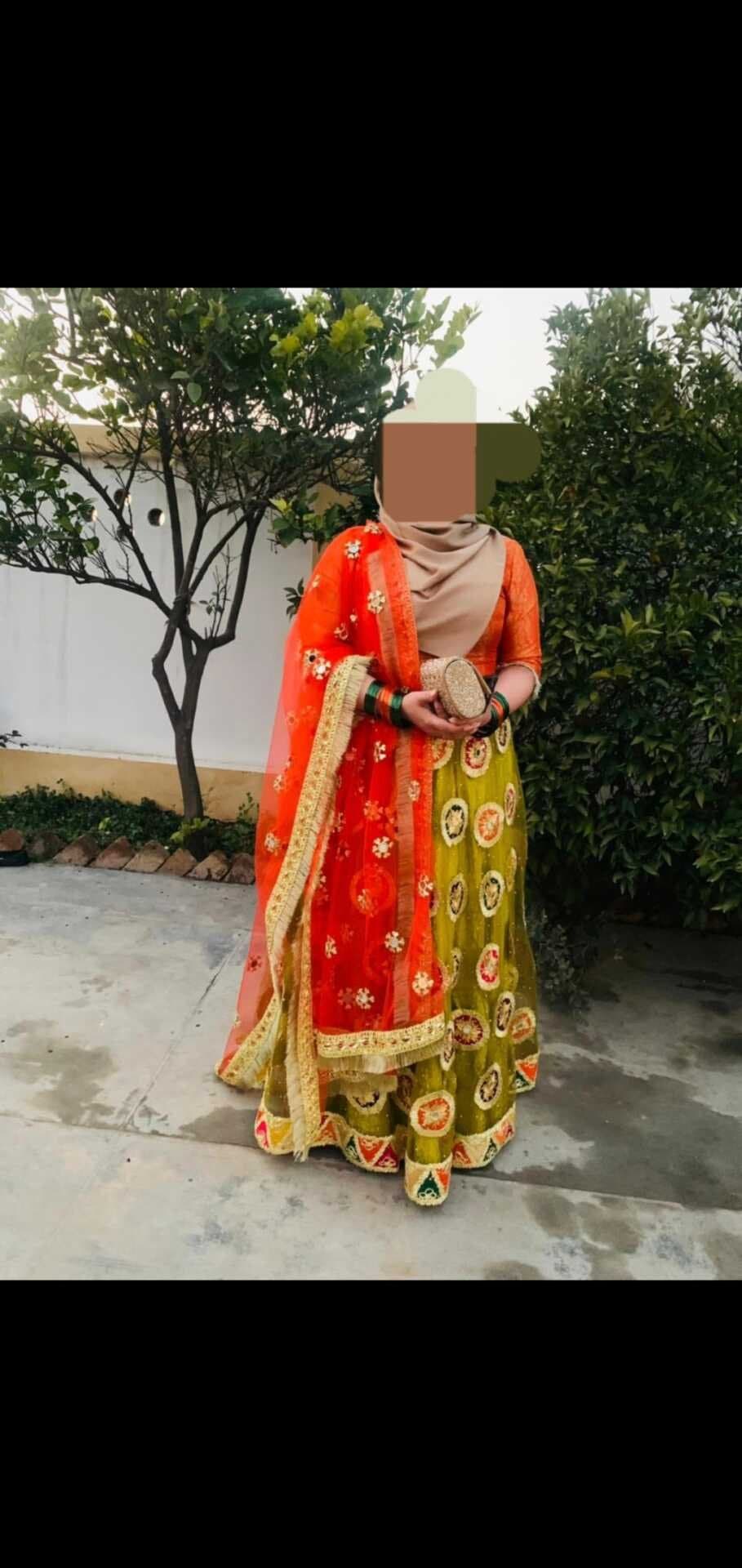 Bridal/ party wear mendhi dress. Green multi coloured skirt and orange blouse — image 1