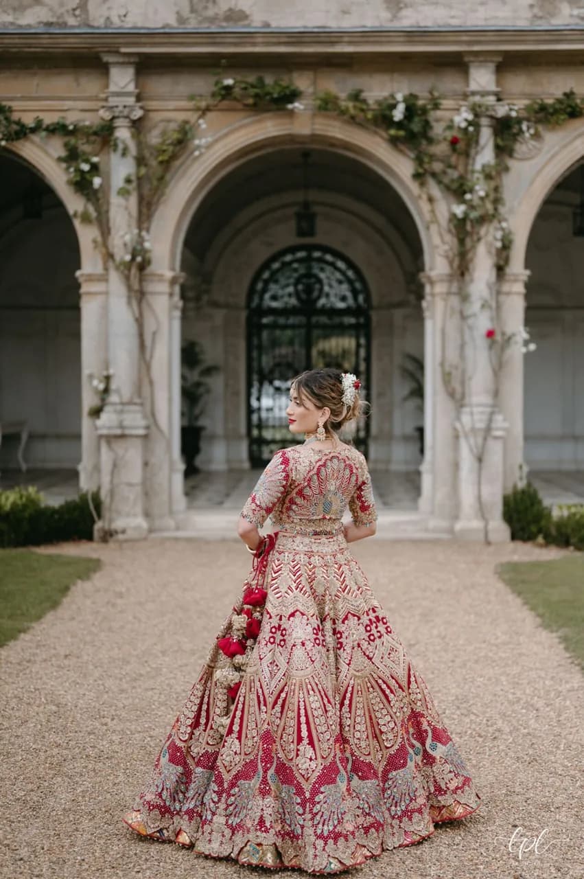 Rimple and Harpreet Red Wedding Lehenga — image 1