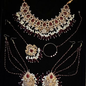 Gold and deep red bridal jewellery with white pearls