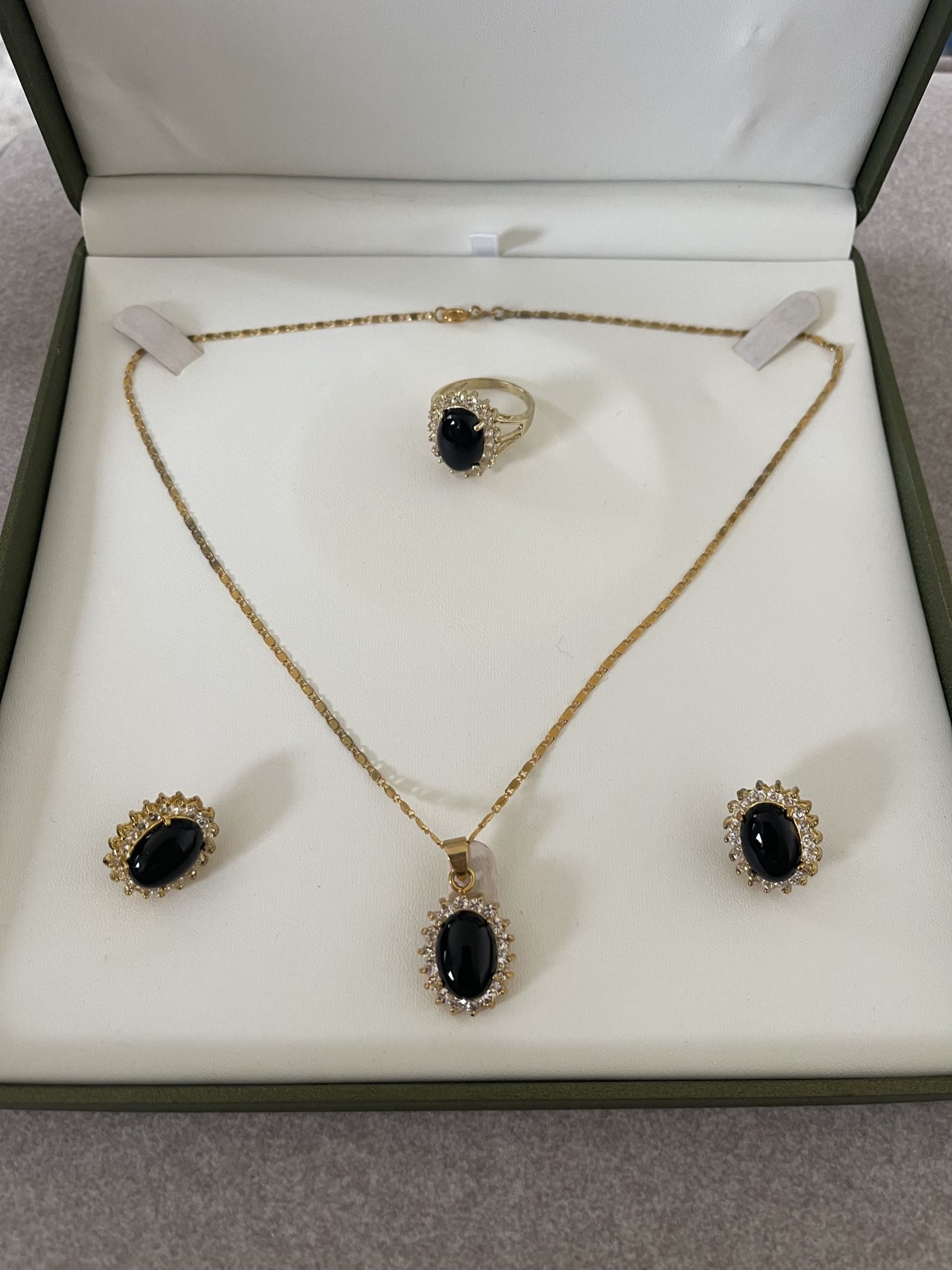 black and gold pendant earring and ring