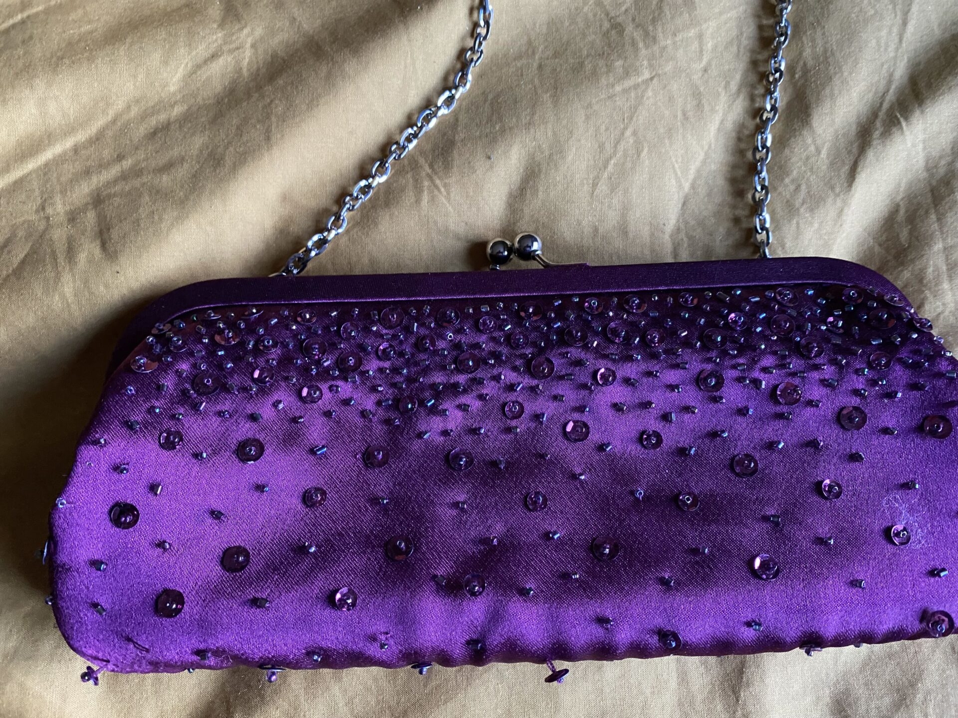 Purple sequin clutch bag