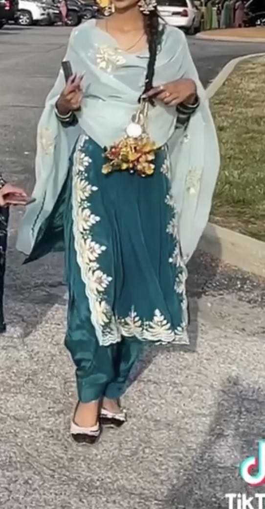 A 3 piece salwaar with a dress and slits on the side