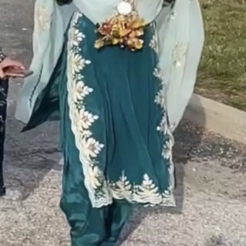 A 3 piece salwaar with a dress and slits on the side